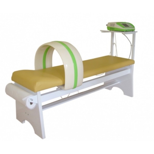 Magnetronic MF-12 z aplikatorem kołowym umieszczonym na stole zabiegowym do magnetoterapii.