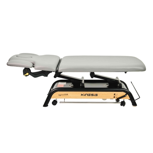 Milton MTR w pozycji leżącej, z segmentem zagłówka i mechanizmem regulacji wysokości.