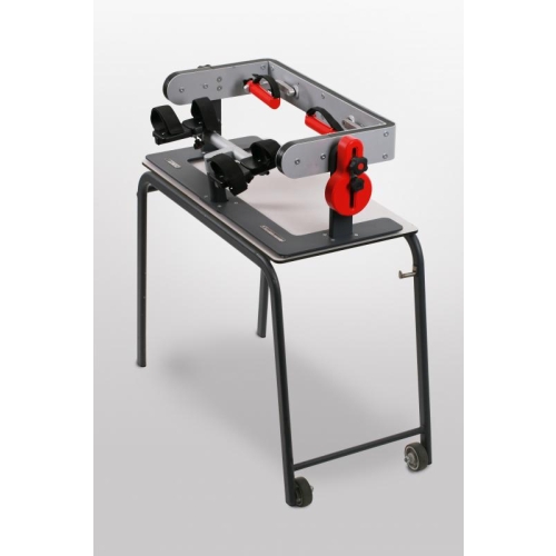 PICTOR – aparat do ćwiczeń nadgarstka zamontowany na stoliku rehabilitacyjnym.