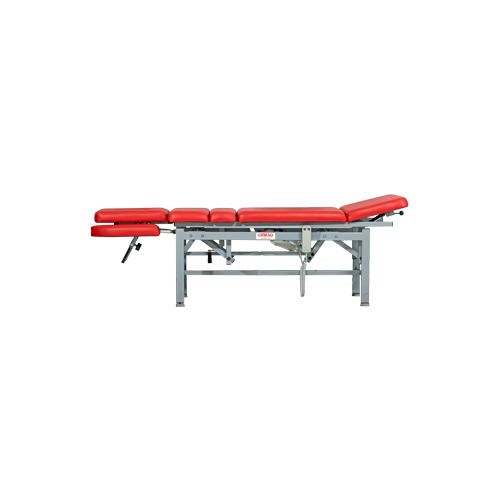 Stół SM-E7 w pozycji leżącej z regulacją sekcji kończyn i tułowia.
